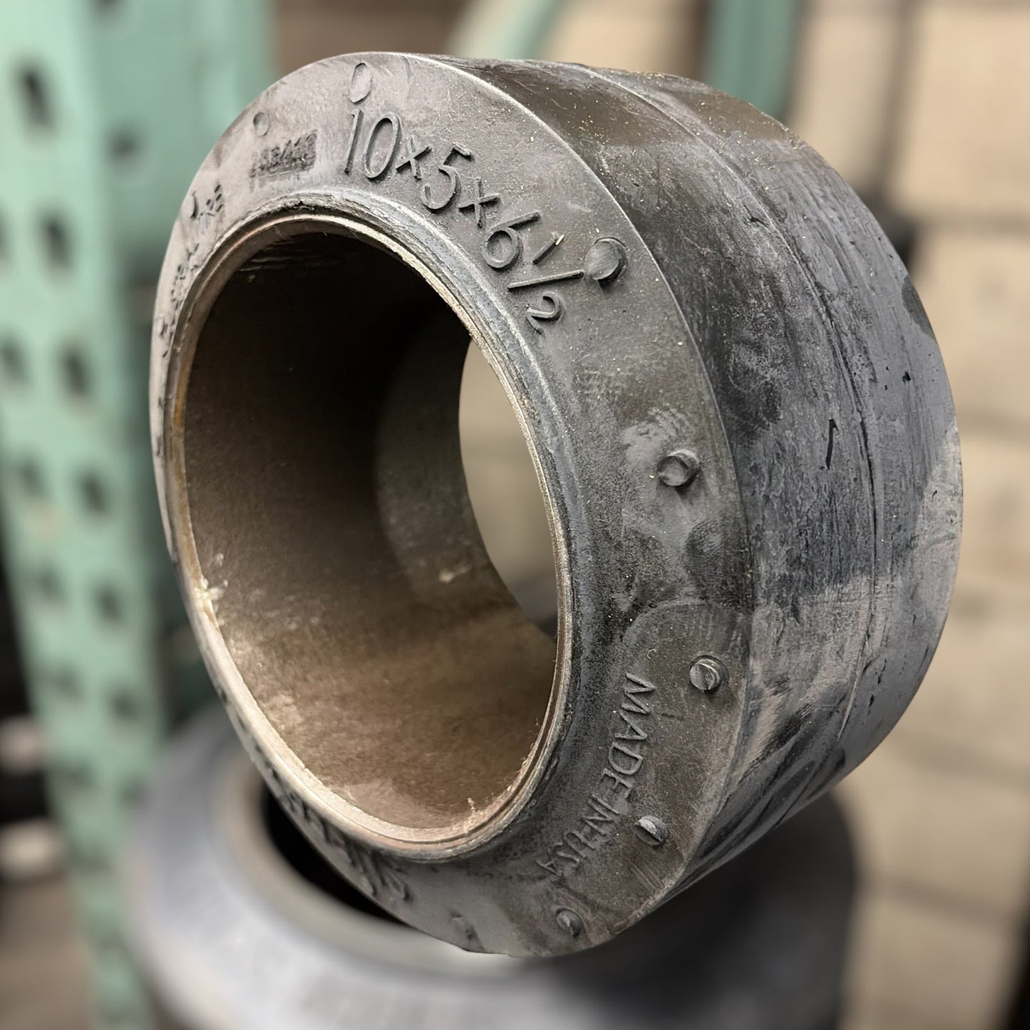 forklift tire with size markings on a blurred background