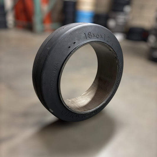 18x6x12.125 (18x6x12 ⅛) forklift tire smooth cushion warehouse background