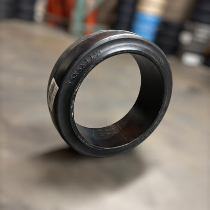 15x5x11.25smooth warehouse forklift press on cushion tire blurred backgorund