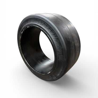 Black rubber tire rim on a white background