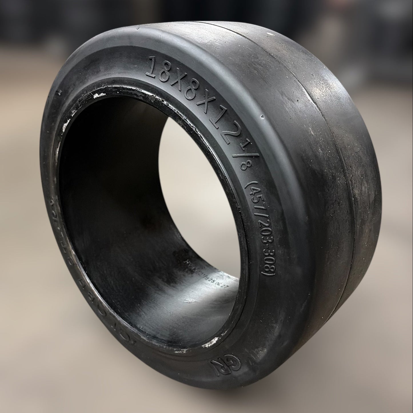Black rubber forklift tirebushing on a blurred background