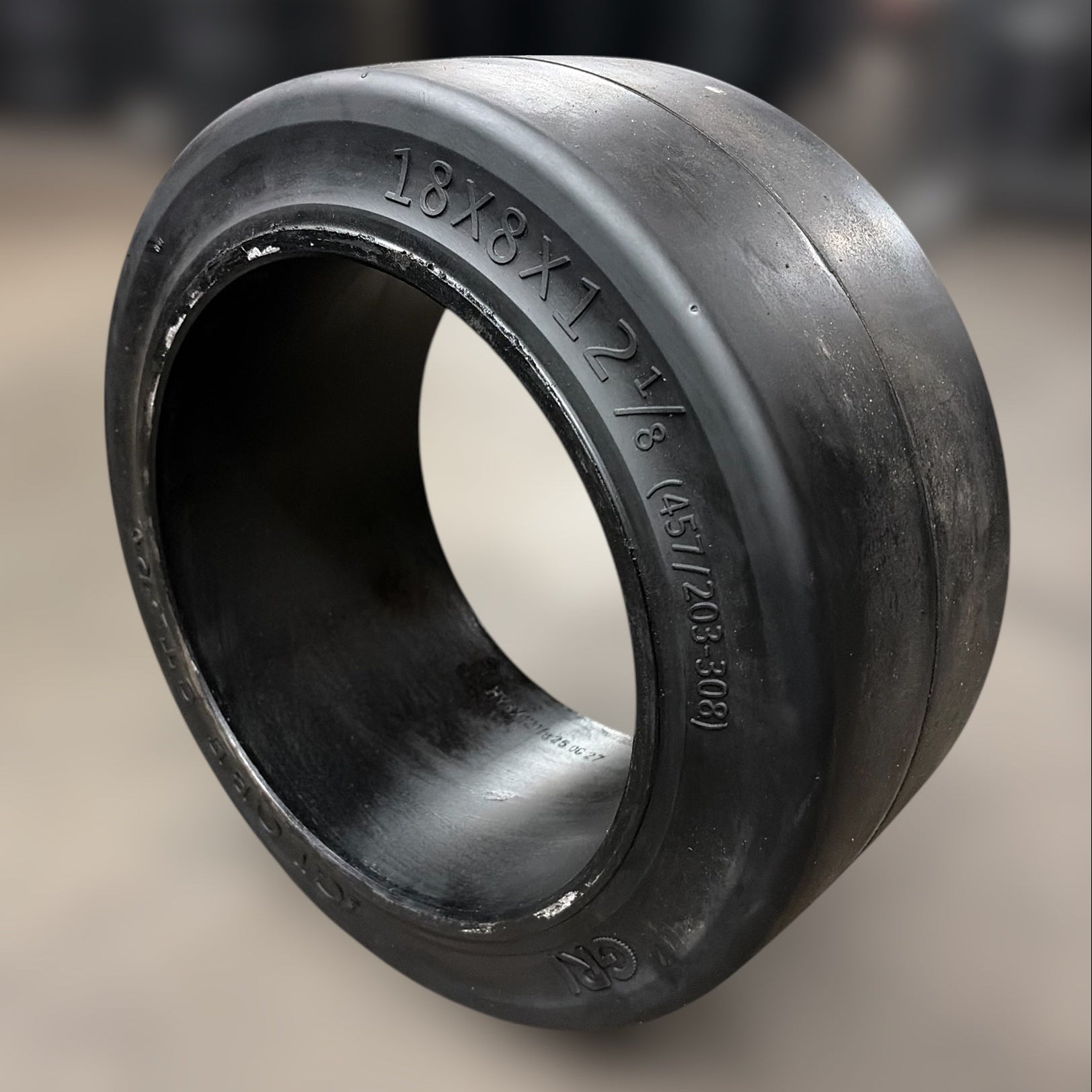 Black rubber forklift tirebushing on a blurred background