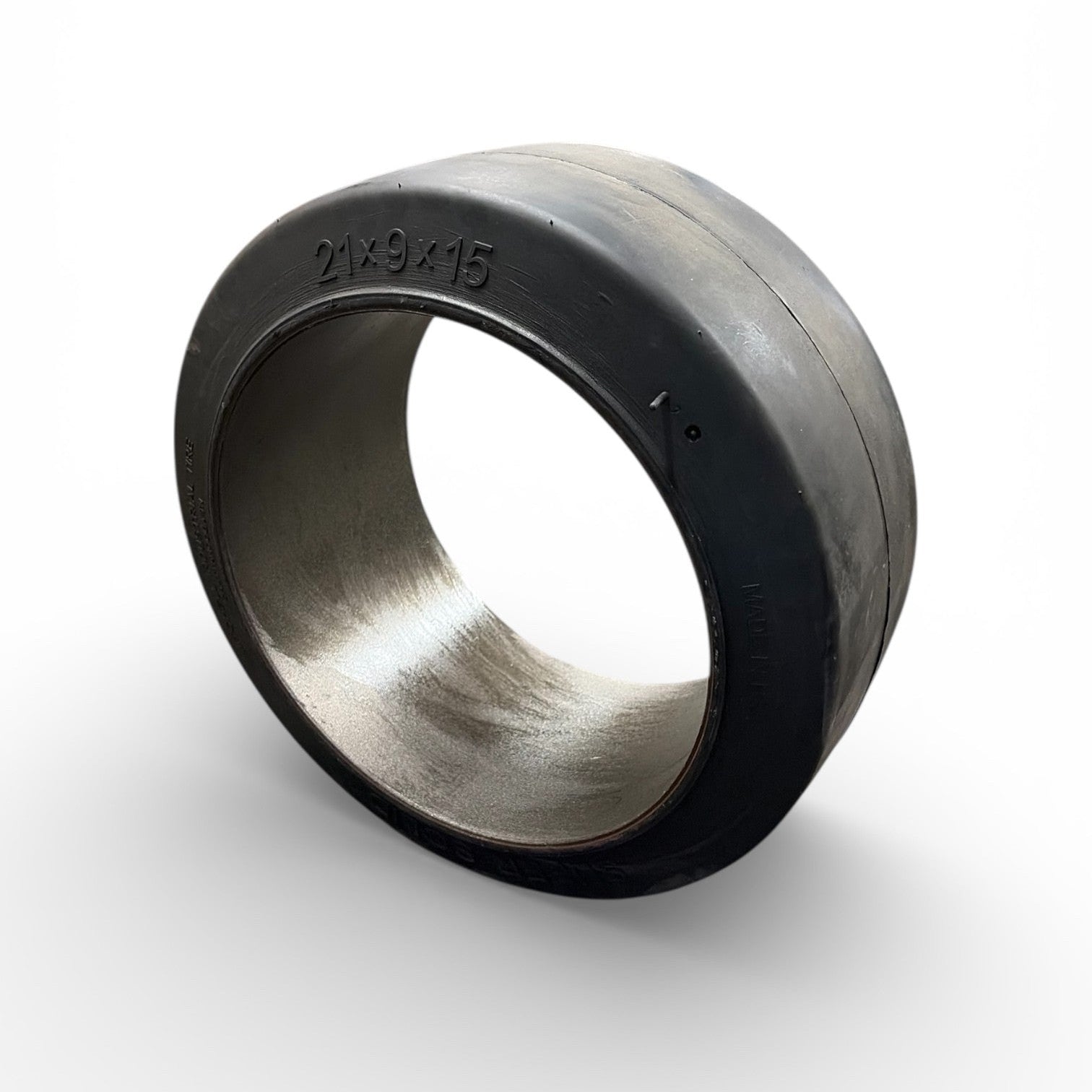 Metallic and rubber forklift tire  ring on a white background